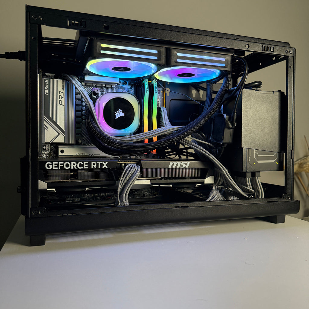 Open computer case with RGB lighting on a white surface